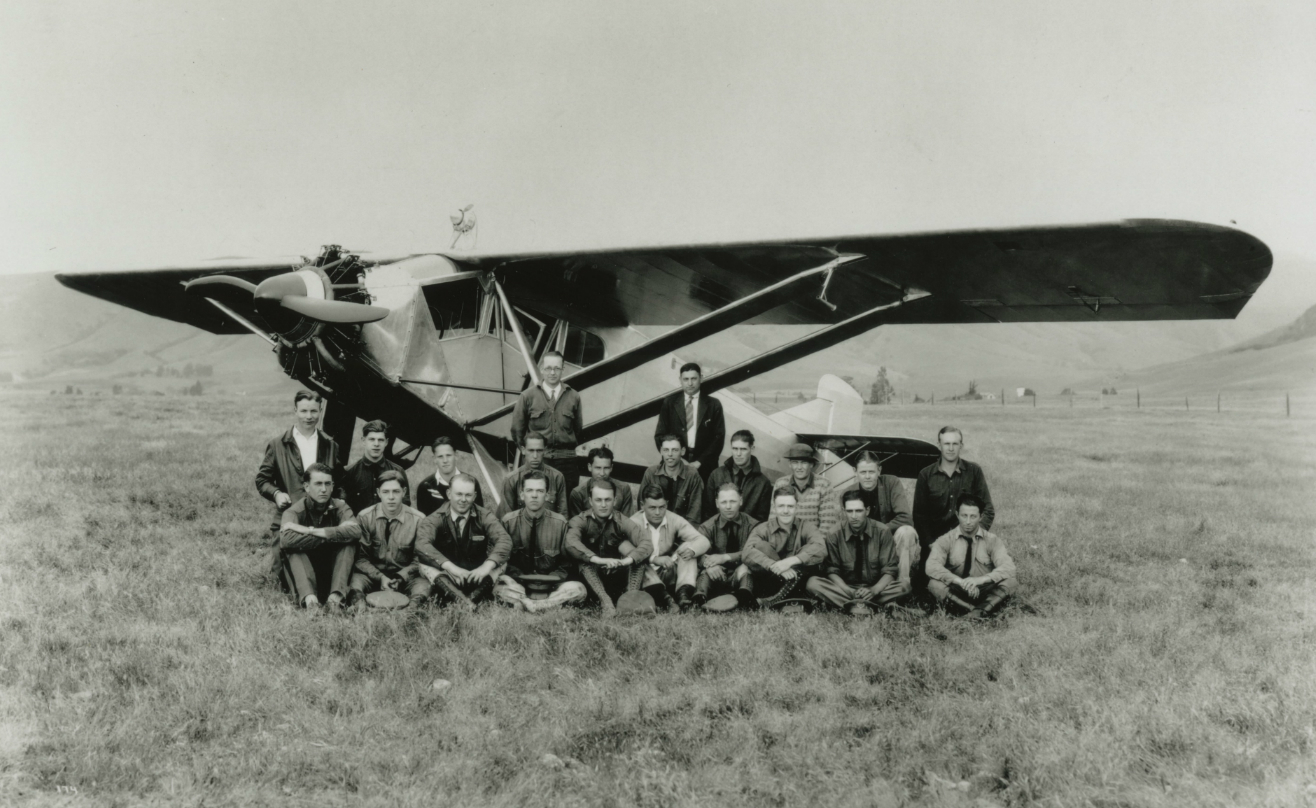 Aeronautics students in 1928 with The Glenmont, a six-passenger plane patterned after The Spirit of St. Louis. The first aircraft built on campus by students, the Glenmont's name derived from two faculty members, department head H. Glen Warren (standing at left) and J. G. Montijo (standing at right).—Caption from the University Archives