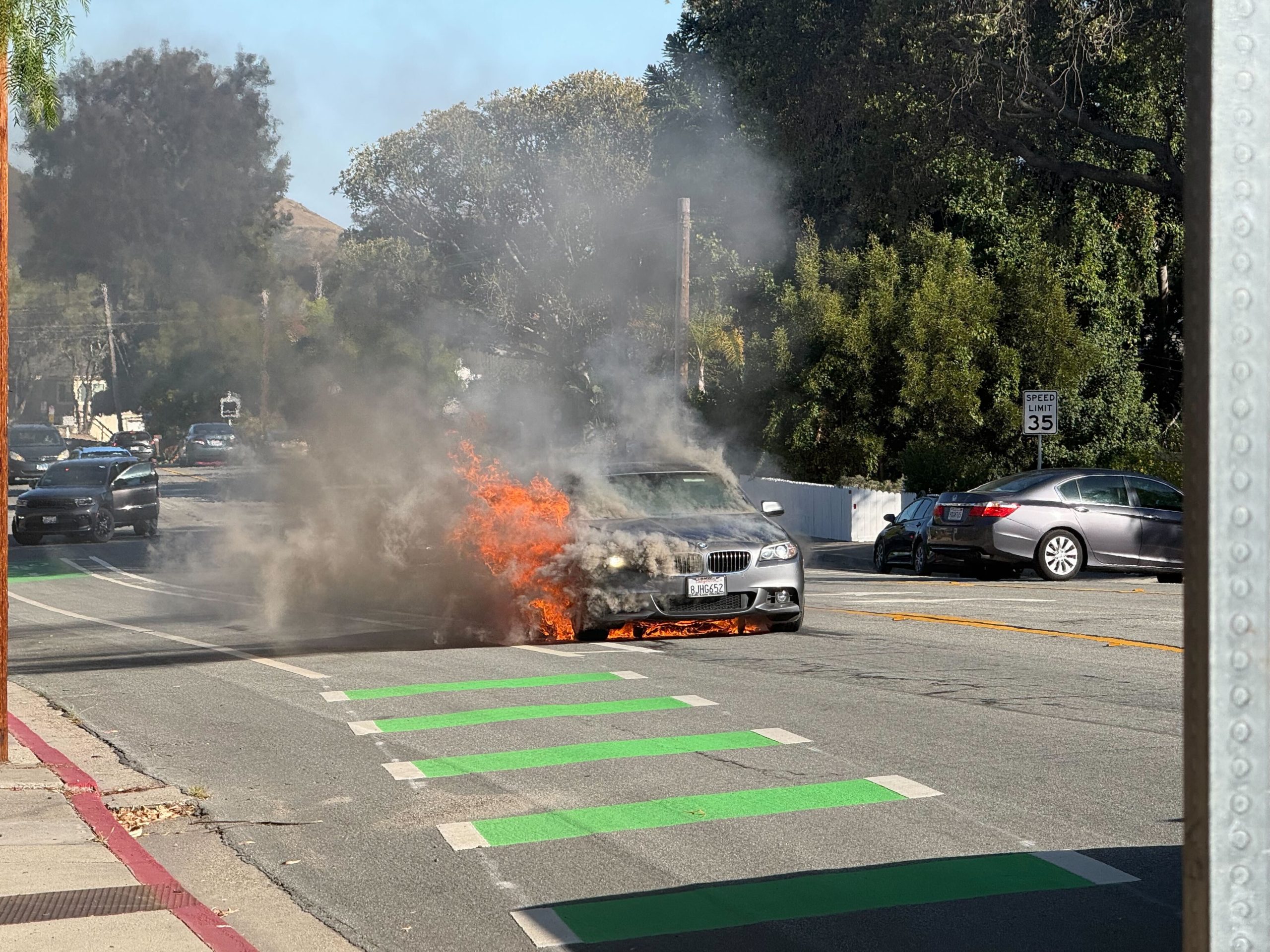 Fathers rescue driver from burning BMW on Johnson Avenue